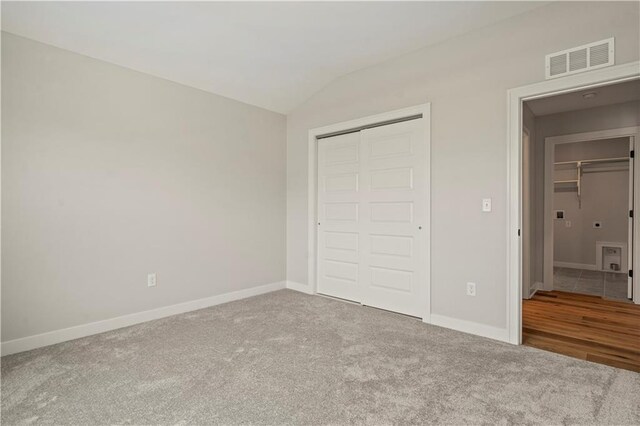 1925 SW Merryman Dr, Lees Summit, MO 64082 - unfurnished bedroom featuring vaulted ceiling, carpet floors, a closet, and baseboards
