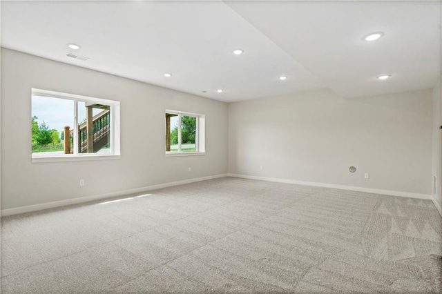 1925 SW Merryman Dr, Lees Summit, MO 64082 - spare room featuring baseboards, recessed lighting, and light colored carpet