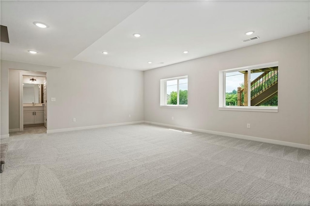 1925 SW Merryman Dr, Lees Summit, MO 64082 - unfurnished room featuring light colored carpet, baseboards, and recessed lighting