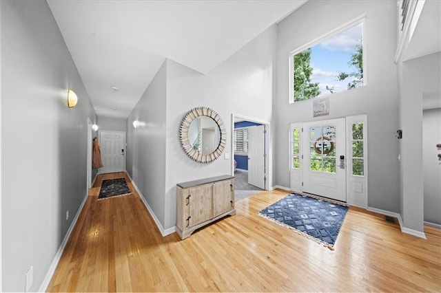 19P Lake Shore Dr, Lake Lotawana, MO 64086 - entrance foyer with wood finished floors and a towering ceiling