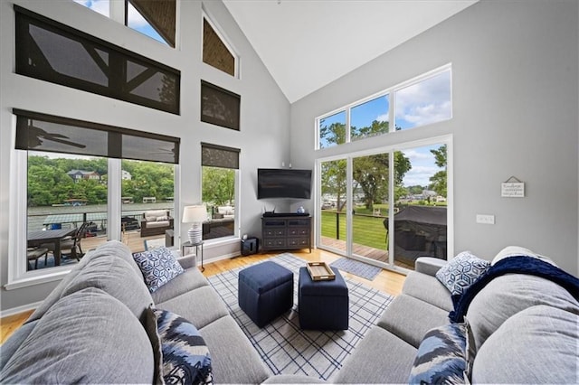 19P Lake Shore Dr, Lake Lotawana, MO 64086 - living area featuring high vaulted ceiling and wood finished floors