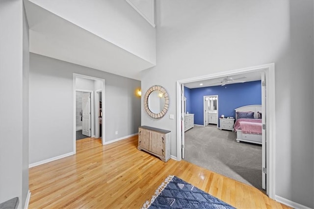19P Lake Shore Dr, Lake Lotawana, MO 64086 - corridor featuring wood finished floors and a high ceiling