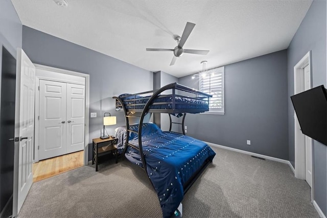 19P Lake Shore Dr, Lake Lotawana, MO 64086 - carpeted bedroom featuring a ceiling fan and a textured ceiling