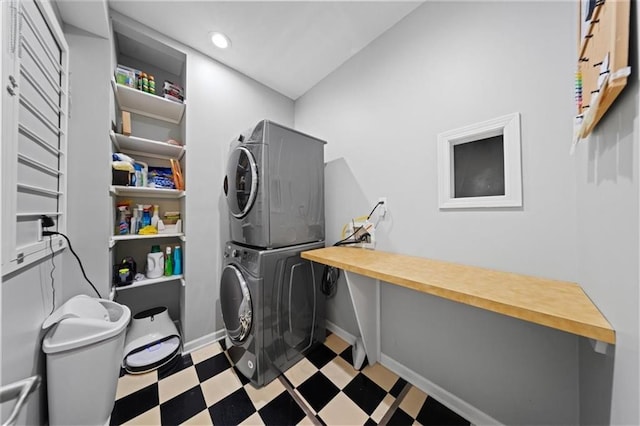 19P Lake Shore Dr, Lake Lotawana, MO 64086 - laundry area with stacked washing machine and dryer, tile patterned floors, and recessed lighting
