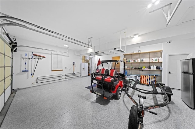 19P Lake Shore Dr, Lake Lotawana, MO 64086 - garage featuring freestanding refrigerator and white refrigerator with ice dispenser