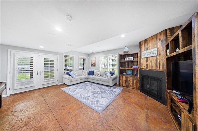 19P Lake Shore Dr, Lake Lotawana, MO 64086 - living area with a large fireplace, french doors, and recessed lighting