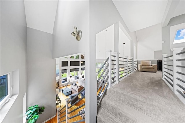 19P Lake Shore Dr, Lake Lotawana, MO 64086 - staircase with high vaulted ceiling