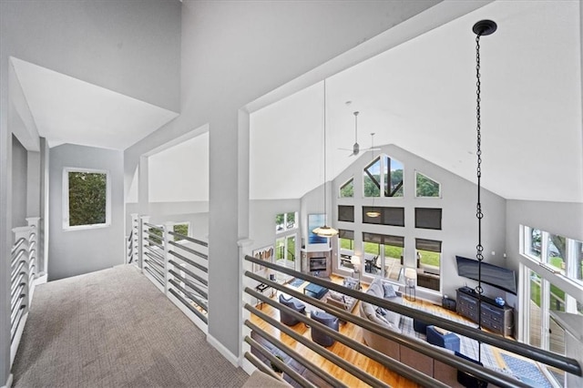 19P Lake Shore Dr, Lake Lotawana, MO 64086 - corridor with high vaulted ceiling, an upstairs landing, and carpet