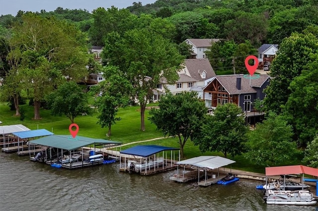 19P Lake Shore Dr, Lake Lotawana, MO 64086 - dock area with boat lift, a water view, and a forest view