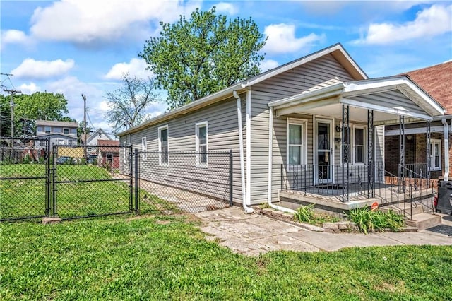 218 S 8th St, Kansas City, KS 66101 - view of front of property with a gate and a porch