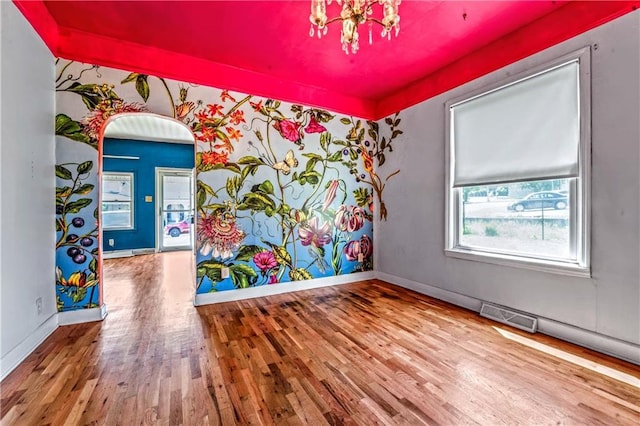 218 S 8th St, Kansas City, KS 66101 - empty room with wood finished floors and baseboards