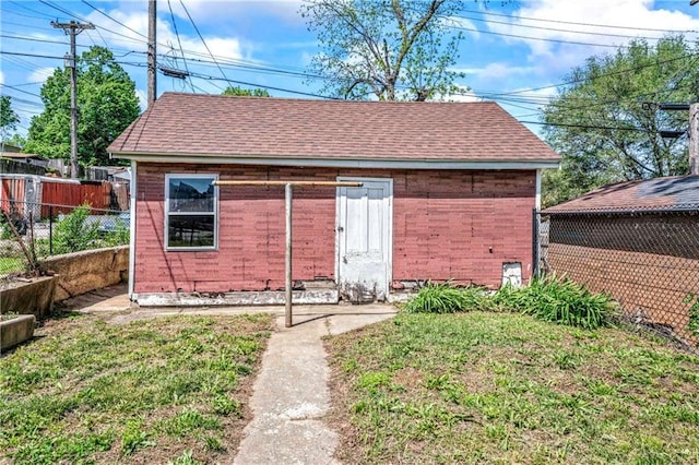 218 S 8th St, Kansas City, KS 66101 - view of outdoor structure with fence and an outbuilding
