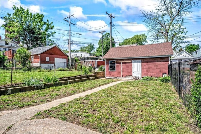 218 S 8th St, Kansas City, KS 66101 - view of yard featuring an outbuilding