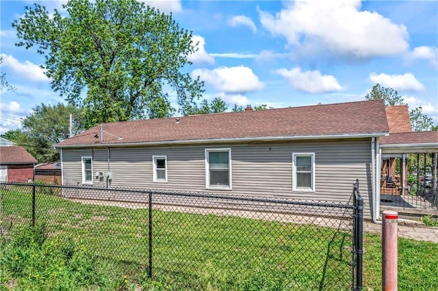218 S 8th St, Kansas City, KS 66101 - back of house with a shingled roof and a patio area