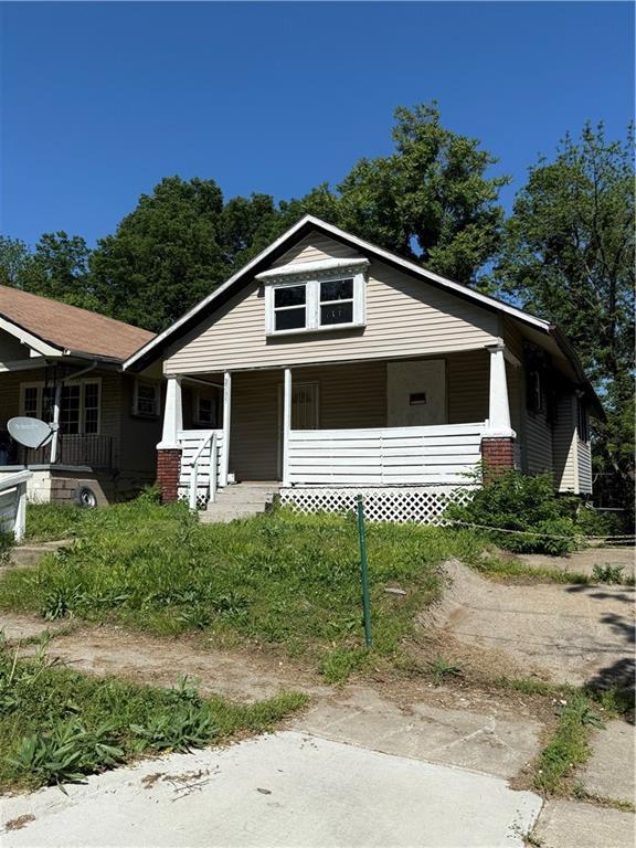 2735 Askew Ave, Kansas City, MO 64128 - bungalow with covered porch
