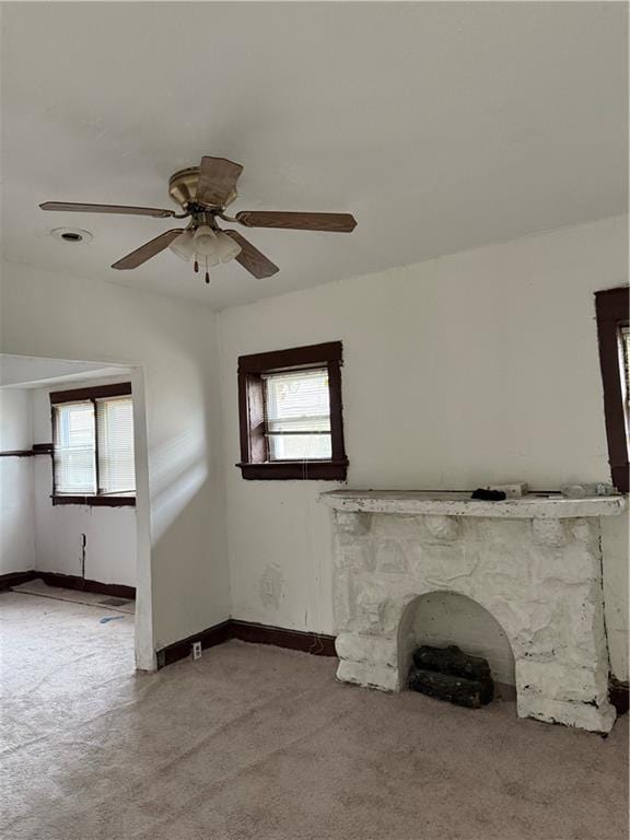 2735 Askew Ave, Kansas City, MO 64128 - unfurnished living room with light colored carpet and ceiling fan