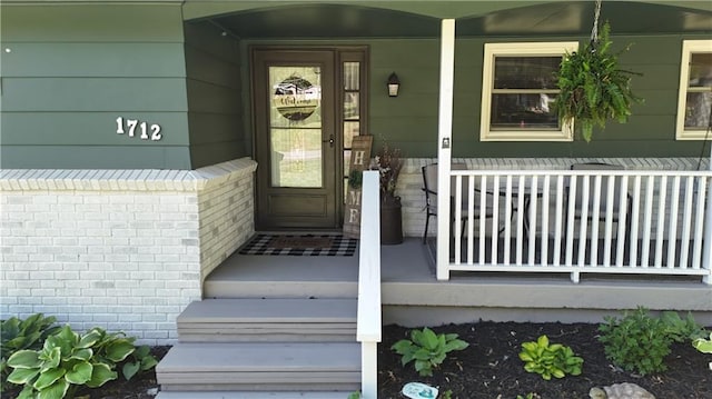 doorway to property with a porch