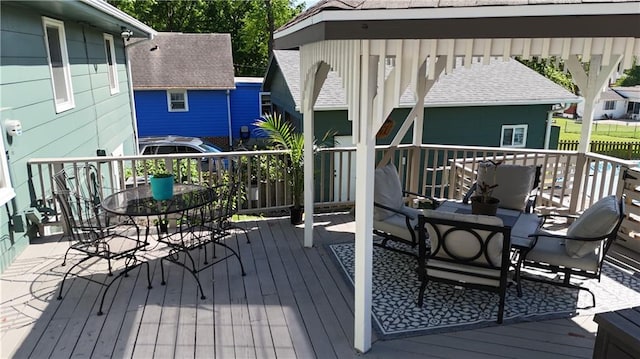 wooden deck featuring outdoor dining space