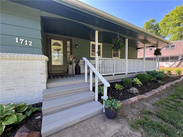 doorway to property with a porch
