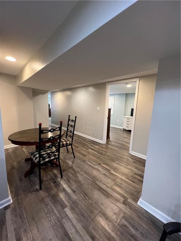 dining space featuring wood finished floors, baseboards, and recessed lighting