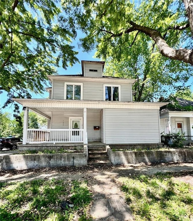 traditional style home featuring a porch