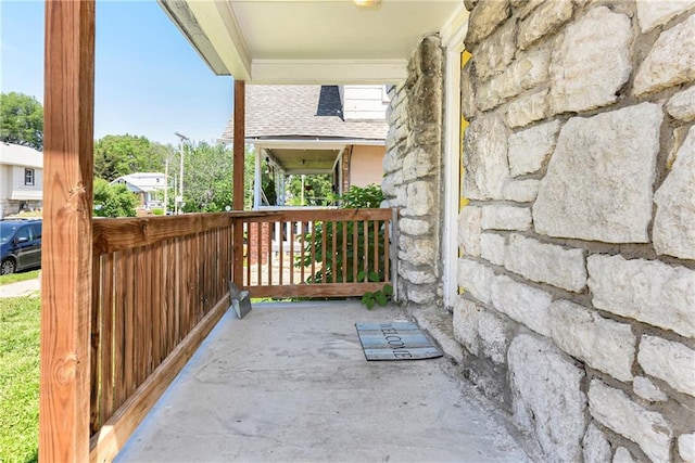 2409 Oakley Ave, Kansas City, MO 64127 - view of patio / terrace with a porch