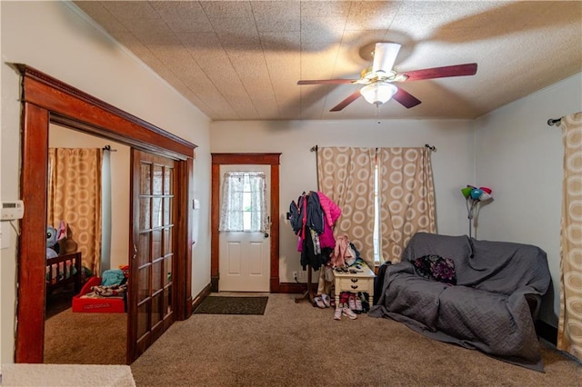 911 N 6th St, Atchison, KS 66002 - entrance foyer featuring carpet flooring and a ceiling fan