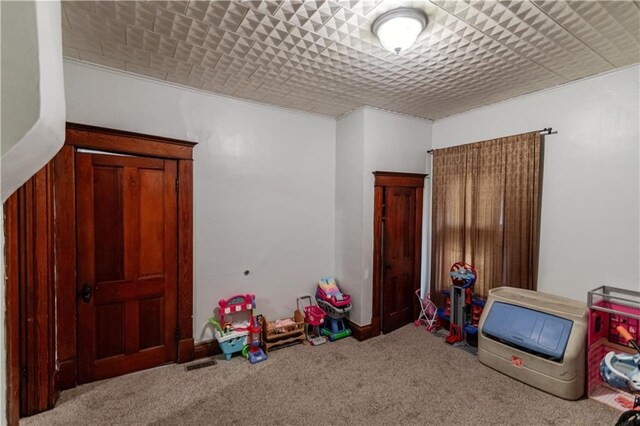 911 N 6th St, Atchison, KS 66002 - playroom with carpet floors