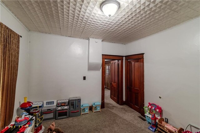 911 N 6th St, Atchison, KS 66002 - recreation room featuring carpet floors and ornamental molding