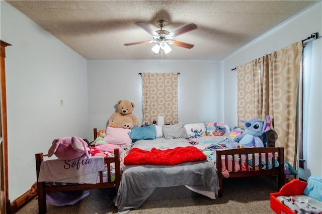 911 N 6th St, Atchison, KS 66002 - carpeted bedroom with a ceiling fan
