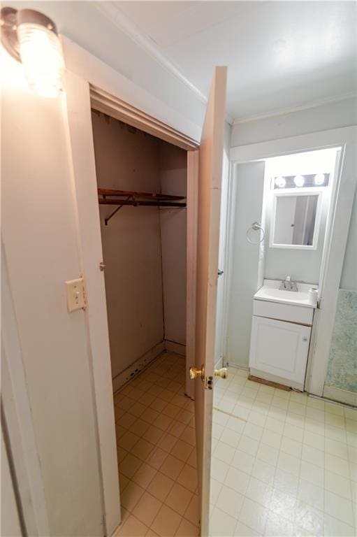 911 N 6th St, Atchison, KS 66002 - bathroom with vanity and ornamental molding