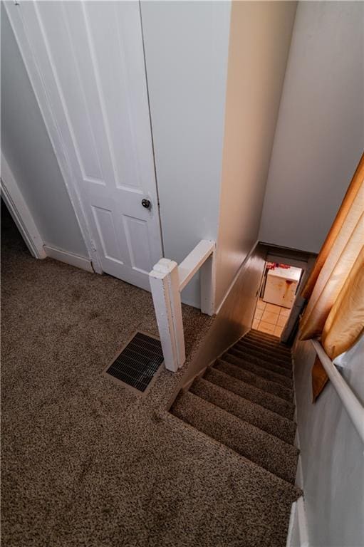 911 N 6th St, Atchison, KS 66002 - staircase with carpet flooring