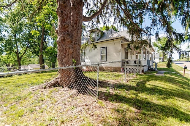 911 N 6th St, Atchison, KS 66002 - view of side of home featuring covered porch