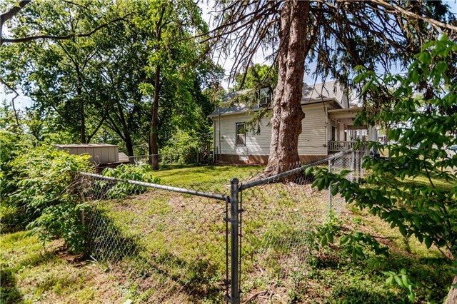 911 N 6th St, Atchison, KS 66002 - view of yard with a storage shed and an outdoor structure