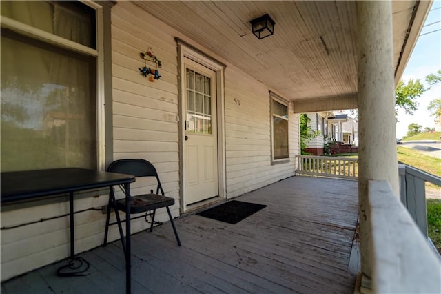 911 N 6th St, Atchison, KS 66002 - wooden deck featuring covered porch