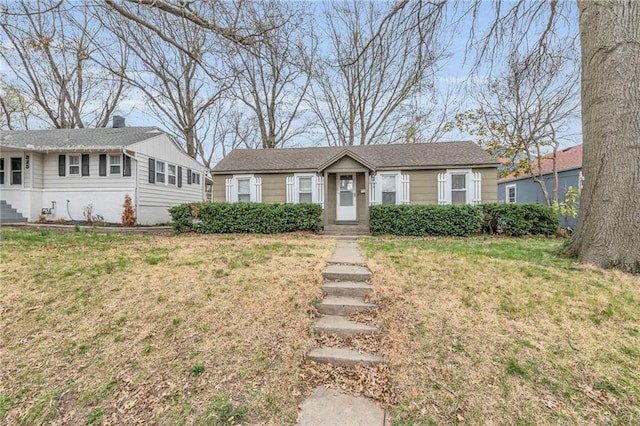 ranch-style house with a front lawn