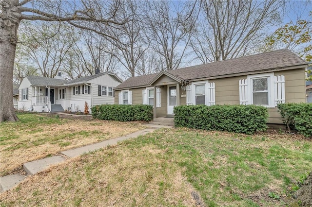 ranch-style home featuring a front yard