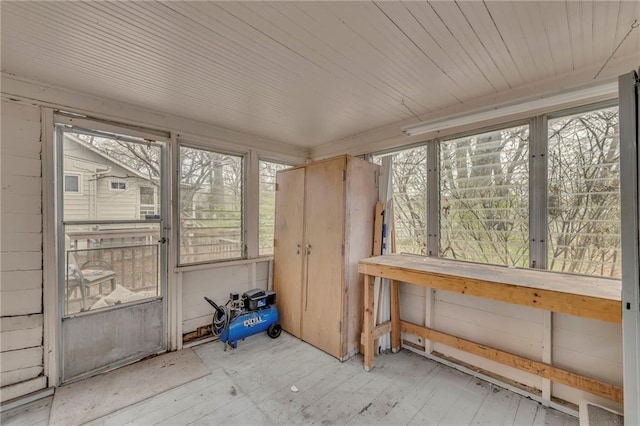 unfurnished sunroom with healthy amount of natural light