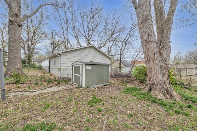view of shed featuring fence