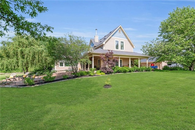 11261 238th St, Lawrence, KS 66044 - farmhouse-style home with a front lawn, a chimney, and covered porch