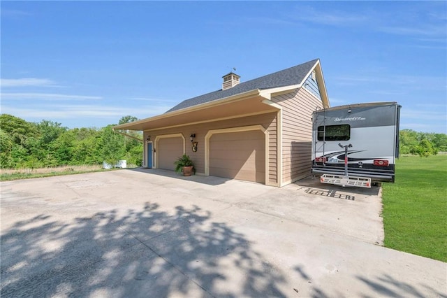 11261 238th St, Lawrence, KS 66044 - view of side of home with a garage