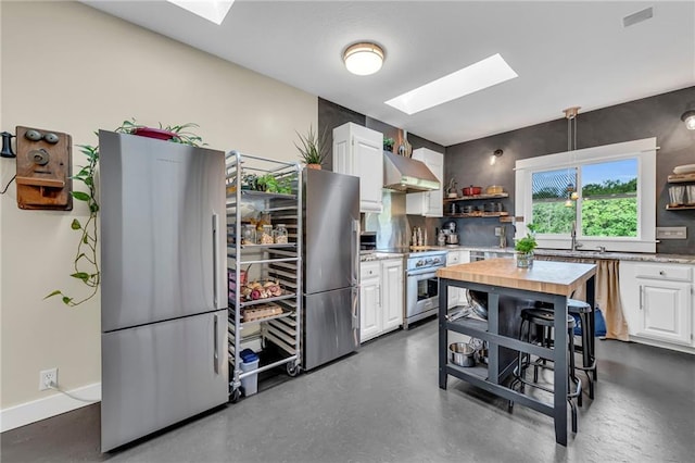 11261 238th St, Lawrence, KS 66044 - kitchen with a skylight, stainless steel appliances, open shelves, and white cabinets