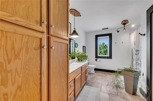 11261 238th St, Lawrence, KS 66044 - full bath with toilet, vanity, and baseboards