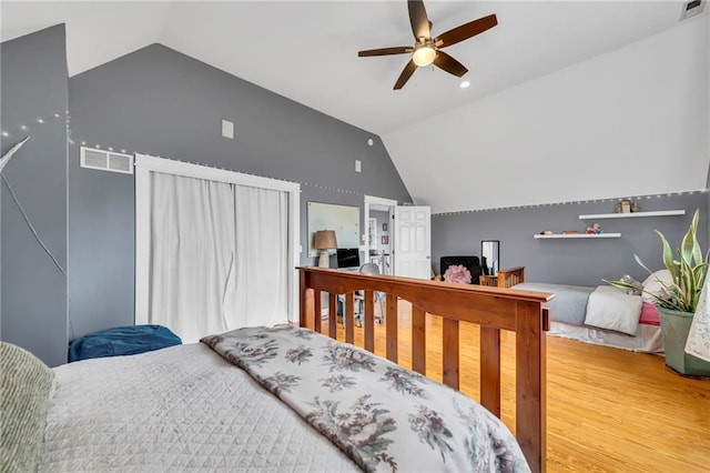 11261 238th St, Lawrence, KS 66044 - bedroom with vaulted ceiling, wood finished floors, ceiling fan, and recessed lighting