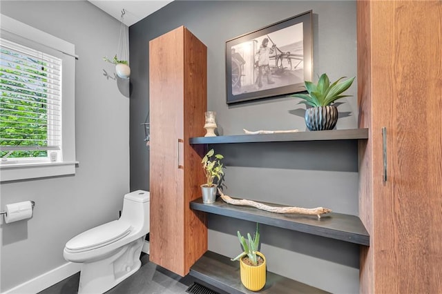 11261 238th St, Lawrence, KS 66044 - bathroom featuring toilet and baseboards