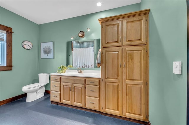 11261 238th St, Lawrence, KS 66044 - bathroom with baseboards, toilet, and vanity