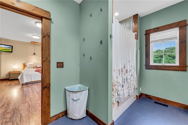11261 238th St, Lawrence, KS 66044 - bathroom featuring baseboards, ensuite bathroom, and a shower with curtain