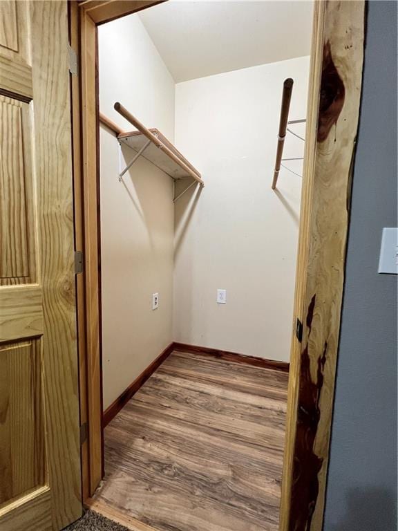 702 N Cedar St, Nevada, MO 64772 - spacious closet with wood finished floors