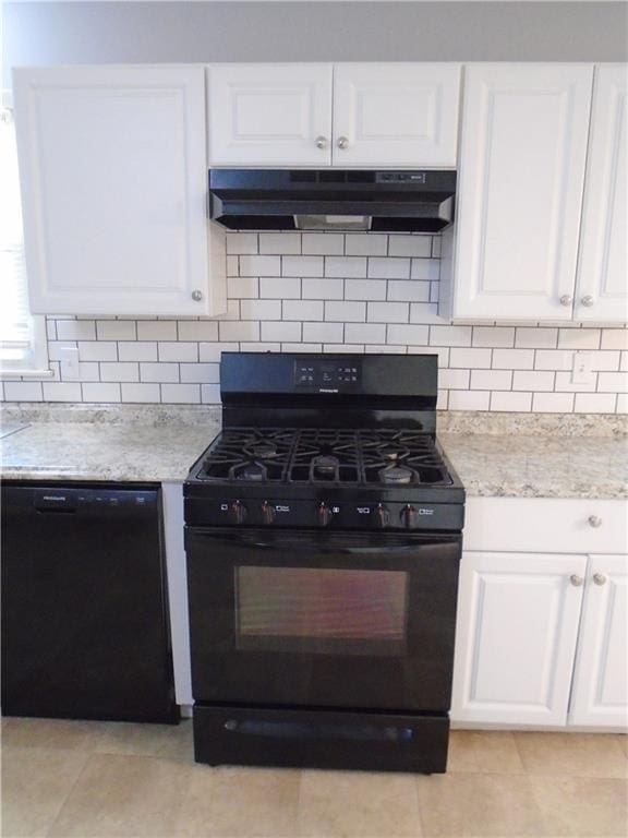 3020 N 81st St, Kansas City, KS 66109 - kitchen featuring black appliances, under cabinet range hood, white cabinetry, and decorative backsplash