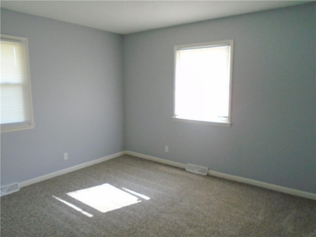 3020 N 81st St, Kansas City, KS 66109 - carpeted empty room featuring baseboards